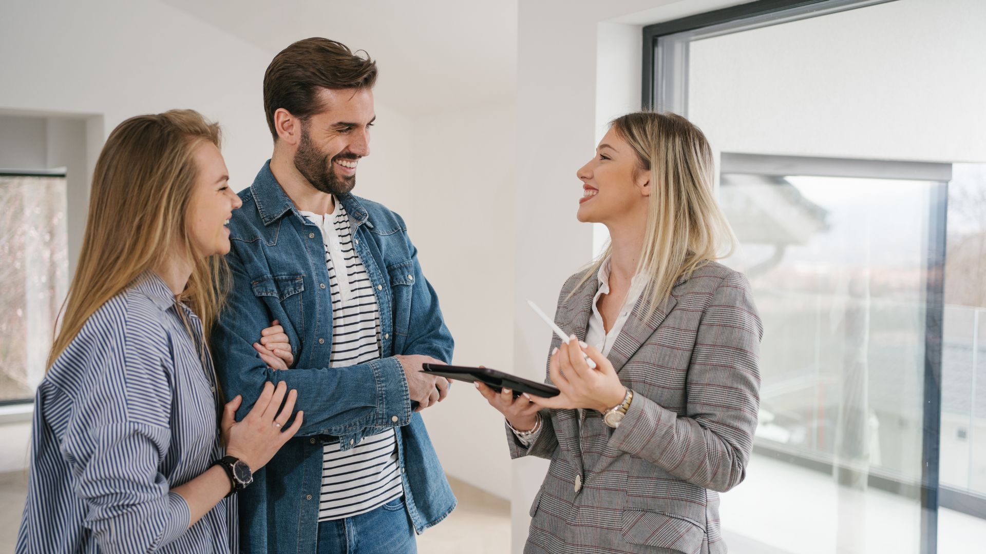Taylor-Street-trusted Three people standing in an apartment